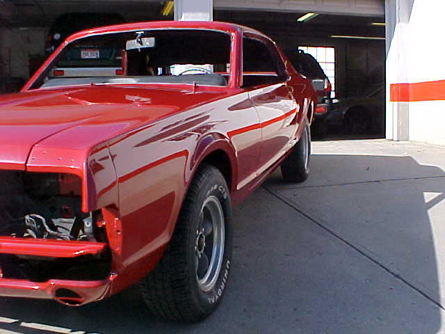 Red 1967 Mercury Cougar with front end removed, viewed from the front quarter