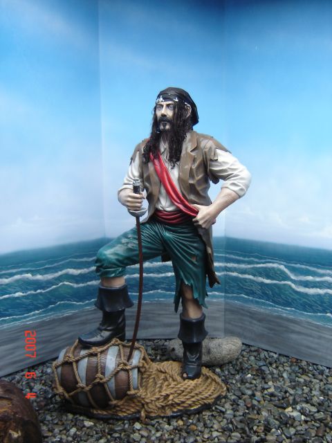 1993 Ford Bronco - A pirate statue is depicted in a diorama setting with a painted ocean and sky background.