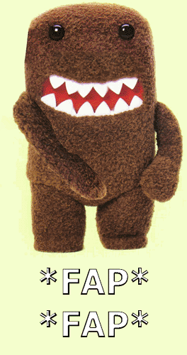1991 Ford Bronco - A Domo-kun plush toy stands with its arms crossed, displaying its signature wide grin and sharp teeth.