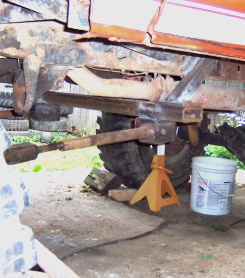 1978 Ford Bronco - Close-up of a vehicle's undercarriage, focusing on suspension and frame components.