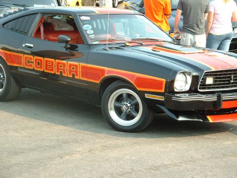 1978 Ford Mustang II - Black 1978 Ford Mustang II Cobra shows off its distinctive orange stripe and lettering package.