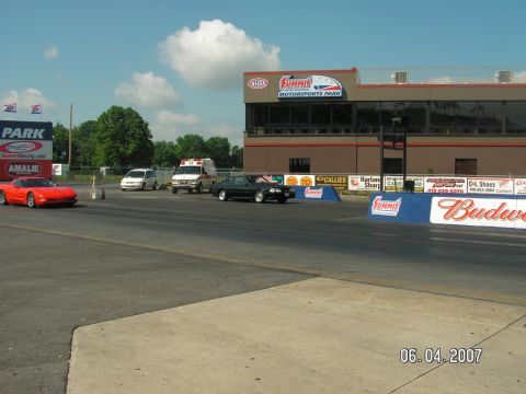 1988 Ford Mustang - A black 1988 Ford Mustang races down the track at Summit Motorsports Park on June 4, 2007.