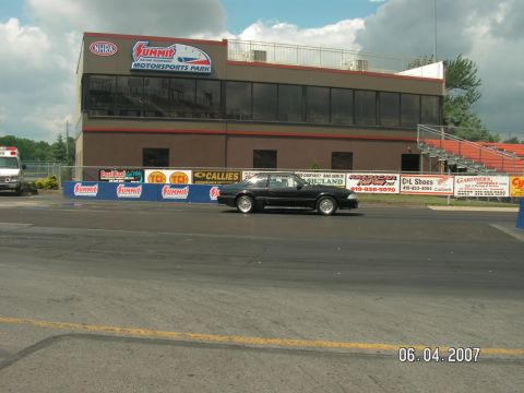 1988 Ford Mustang - Black coupe on drag strip at Summit Motorsports Park, dated June 4, 2007.