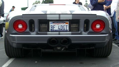 1990 Ford Probe - Rear view of a gray Ford GT with racing stripes and a California license plate.
