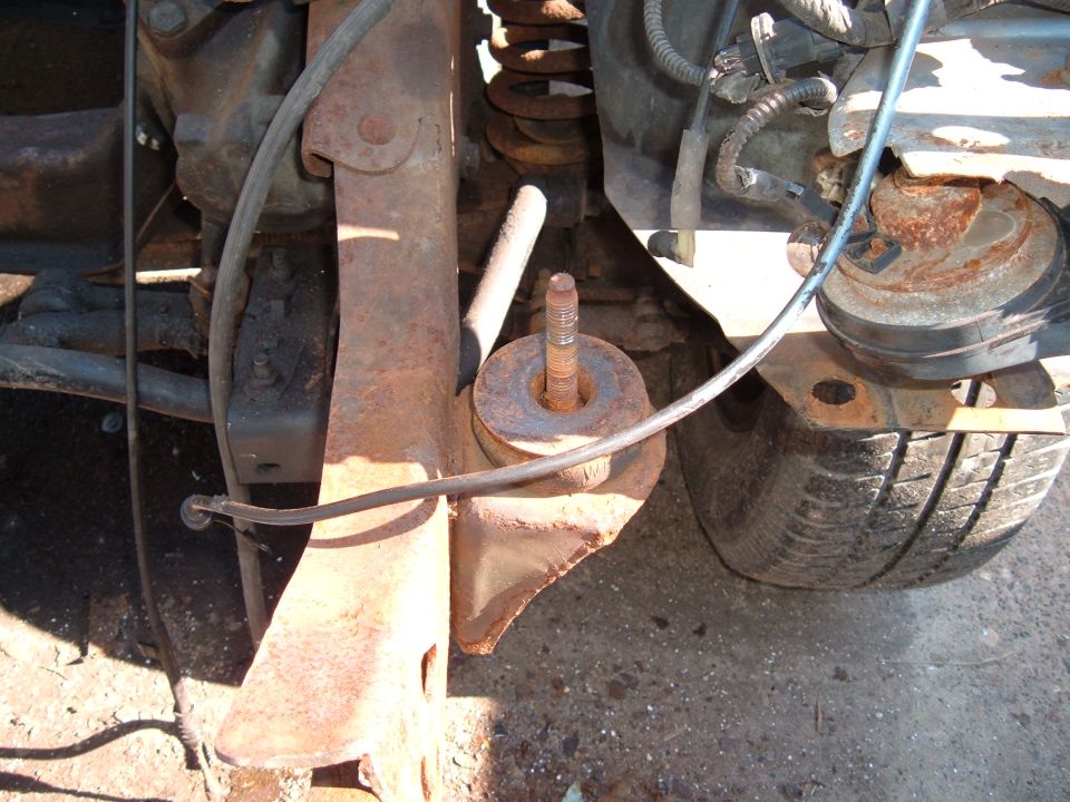 Rusted suspension parts and tire of a vehicle