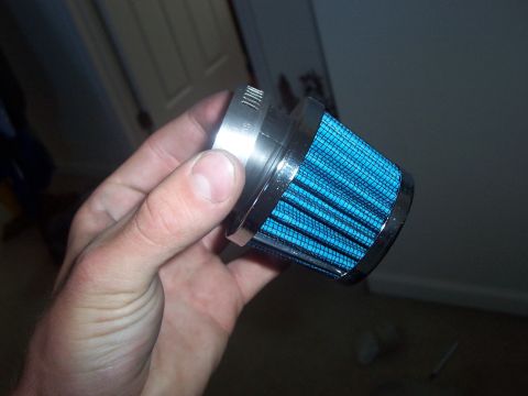 1993 Ford Probe - A blue cone air filter is held in a person's hand, showing its mesh and clamp details.