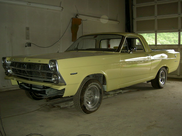 Yellow 1967 Ford Ranchero, 3/4 front view in garage