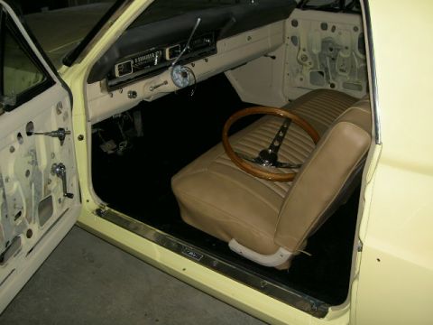 1967 Ford Ranchero - Interior view of a 1967 Ford Ranchero, tan upholstery and a wood-rimmed steering wheel.
