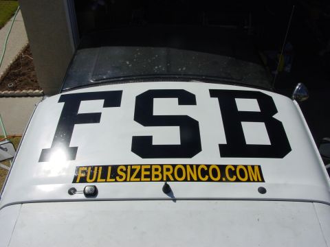 1994 Ford Bronco - The roof of a Ford Bronco displays large lettering and a website address.
