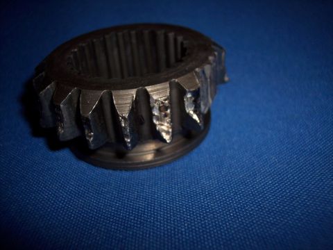 1972 Ford Ranchero - Close-up of a damaged metal gear with visible wear on its teeth.