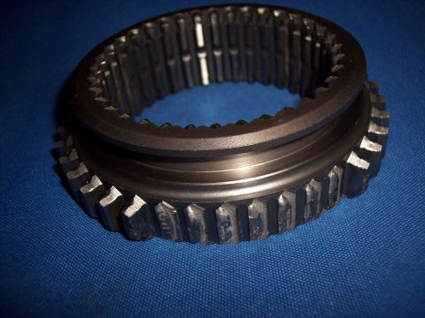 1972 Ford Ranchero - A metal synchronizer ring, a component of a vehicle's transmission, is shown against a blue background.