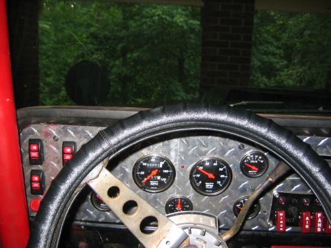 1979 Ford Bronco - Custom interior with multiple gauges and switches visible.