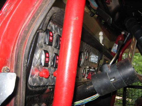 1979 Ford Bronco - Custom dashboard with toggle switches and gauges, steering column and wiring visible.