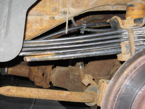 2001 Ford Excursion - This shows the stance of my modded F code springs with the 1/8" shim and 5/8" thick spacer included in the spring pack. (Half a tank of gas…