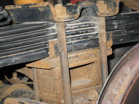 2001 Ford Excursion - Here you can see the piece of the original 5/8" thick anti-wrap leaf and 1/8" shim placed in the F code spring pack. This yielded an overal…