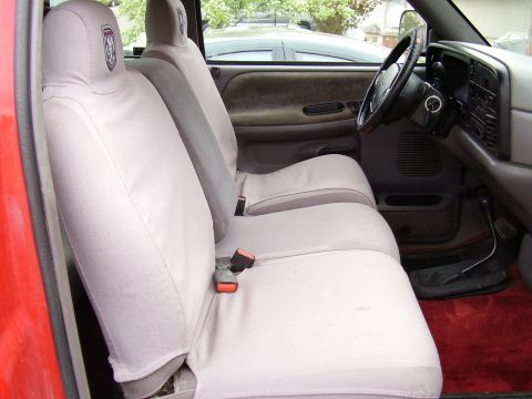1996 Dodge 2500 - Interior view of a 1996 Dodge 2500, light gray seat covers and a red carpet floor.