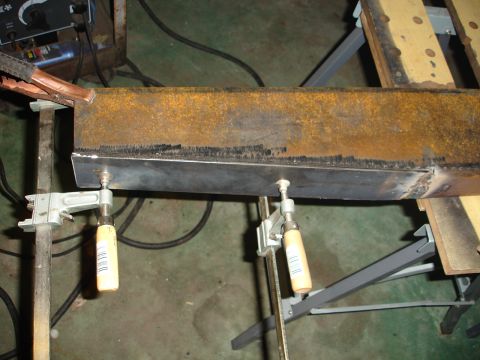 1989 Ford Bronco - Metal beam clamped and ready for welding, part of a custom build.