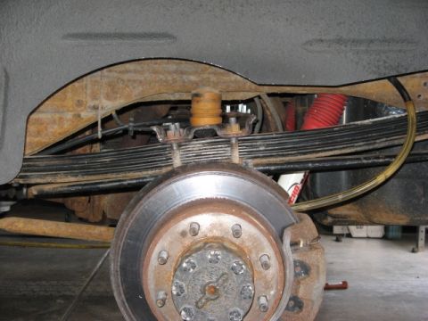 2001 Ford Excursion - This shows the stance of my modded F code springs with the 3rd leaf from the bottom of the original rear leaf pack (the 38" long leaf) incl…
