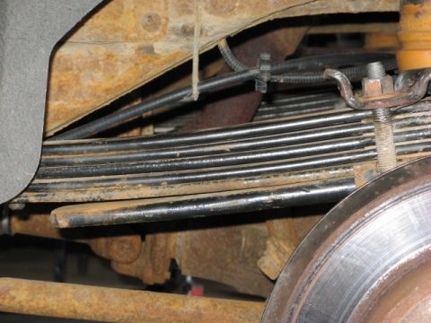 2001 Ford Excursion - This shows the stance of my modded F code springs with the 3rd leaf from the bottom of the original rear leaf pack (the 38" long leaf) incl…