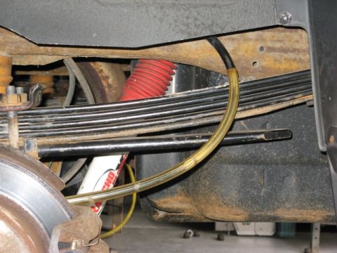 2001 Ford Excursion - This shows the stance of my modded F code springs with the 3rd leaf from the bottom of the original rear leaf pack (the 38" long leaf) incl…