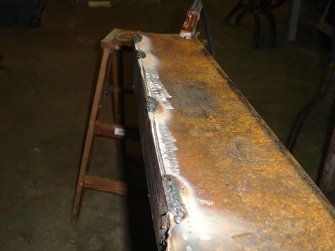 1989 Ford Bronco - Metal part being welded, likely for a custom build.