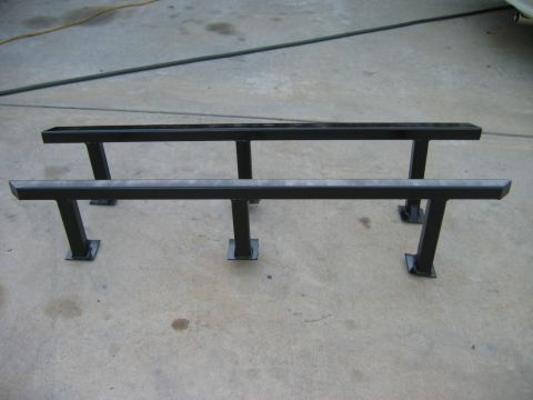 1985 Toyota 4Runner - Aftermarket running boards for a vehicle, shown on a concrete surface.