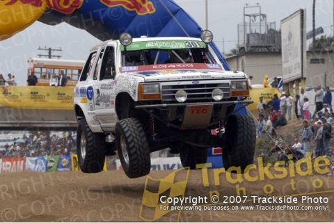 1992 Ford Explorer - This modified SUV is airborne during a race event, its suspension and off-road capabilities.