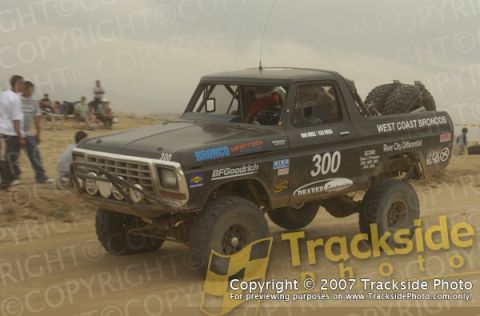 1992 Ford Explorer - This off-road race truck, possibly a Bronco, is seen in a desert environment with various sponsor decals.