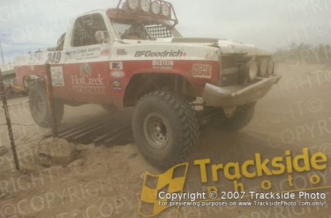 1992 Ford Explorer - This modified truck competes in an off-road race, kicking up dust as it navigates the terrain.