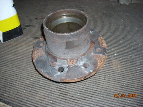 2000 Chevrolet Tahoe - Close-up of a heavily rusted wheel hub assembly, likely a replacement part.