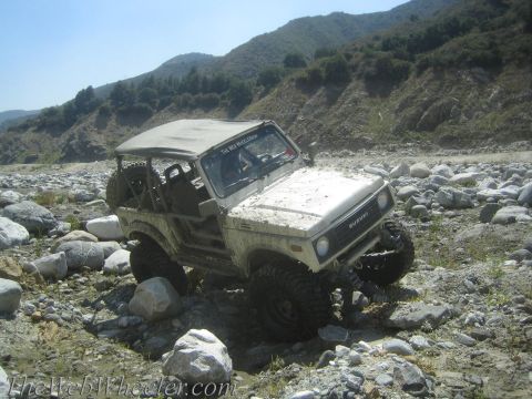 1987 Suzuki Samurai - This 1987 Suzuki Samurai is shown off-roading through a rocky riverbed.