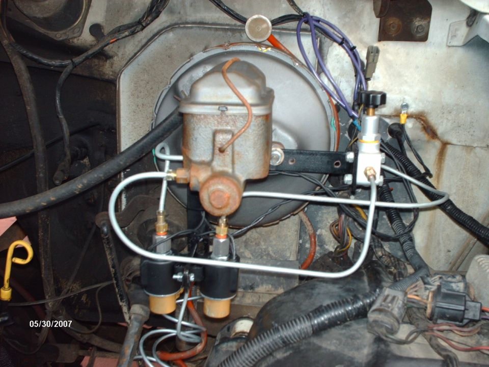 Master cylinder and brake booster plumbed to twin solenoid valves with new brake lines