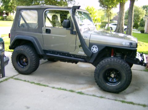 2004 Jeep Wrangler - This 2004 Jeep Wrangler is equipped with a snorkel and aftermarket wheels.