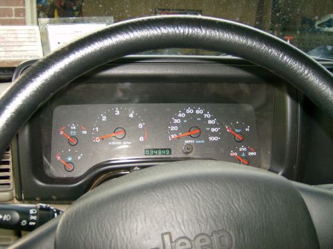 2004 Jeep Wrangler - Dashboard view of a 2004 Jeep Wrangler, showing gauges and odometer reading.
