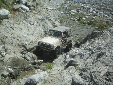 1987 Suzuki Samurai - This 1987 Suzuki Samurai tackles a challenging off-road course with large tires and a lifted suspension.