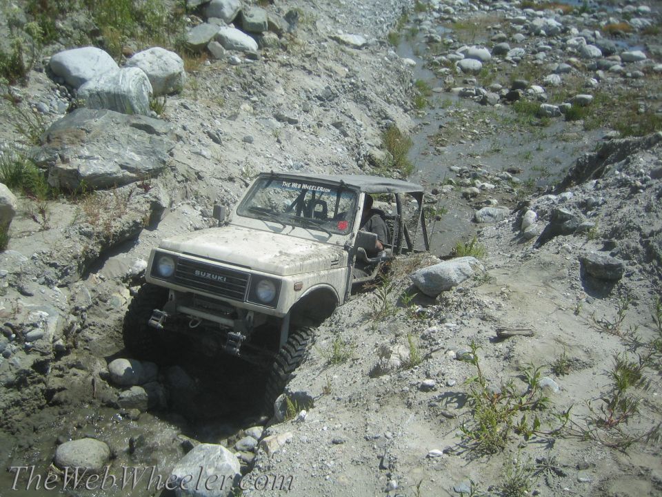 1987 Suzuki Samurai navigating rocky terrain