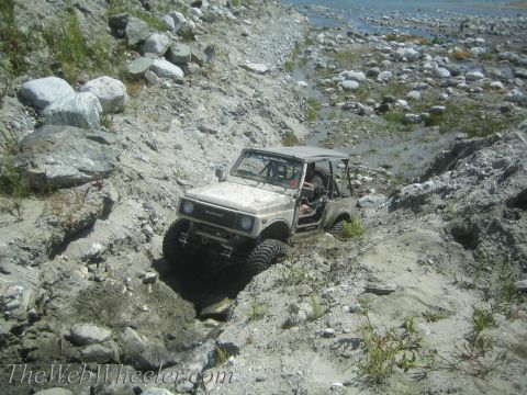 1987 Suzuki Samurai - This 1987 Suzuki Samurai navigates a challenging off-road course through a rocky, dry riverbed.