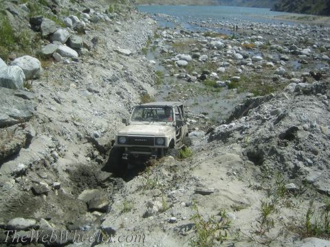 1987 Suzuki Samurai - Suzuki Samurai tackles a challenging off-road course by the water.