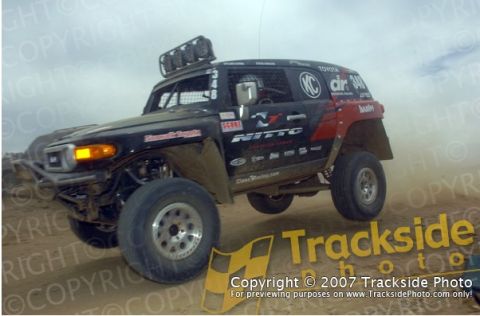1992 Ford Explorer - This Toyota FJ Cruiser is equipped for off-road racing, prominent sponsor decals and roof-mounted lights.