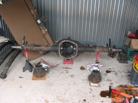 1991 Ford Bronco - Ford rear axle assembly with differential exposed, supported by jack stands.