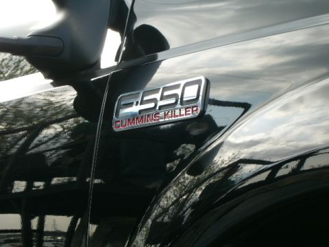 1978 Ford Bronco - The side of a black truck shows an "F-550 CUMMINS KILLER" badge, indicating it's a heavy-duty Ford model.