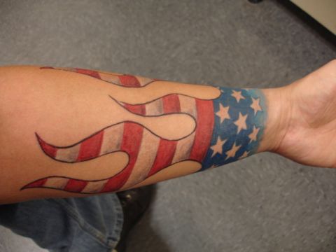 1986 Ford Bronco - Arm tattoo flames and the American flag design.