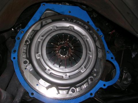 1975 Ford Ranchero - Close-up view of a vehicle's clutch and flywheel assembly, with a blue gasket visible.