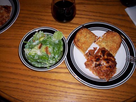 1989 Ford Bronco - A hearty meal lasagna, garlic bread, and a fresh salad is ready to be enjoyed with a glass of wine.