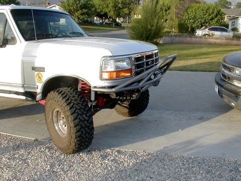 1996 Ford Bronco - Front view of a 1996 Ford Bronco modified with a custom bumper and off-road tires.