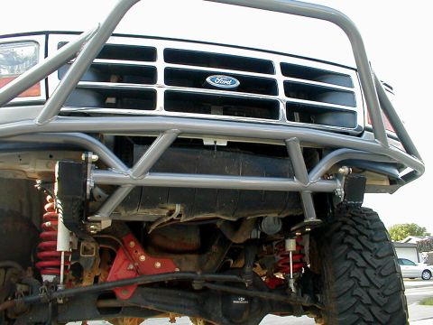 1996 Ford Bronco - Custom front bumper and grille assembly on a 1992 Ford Bronco, showing off its off-road suspension.