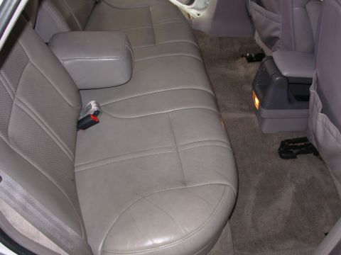 1995 Ford Taurus - Interior view of gray leather rear seats and center console.