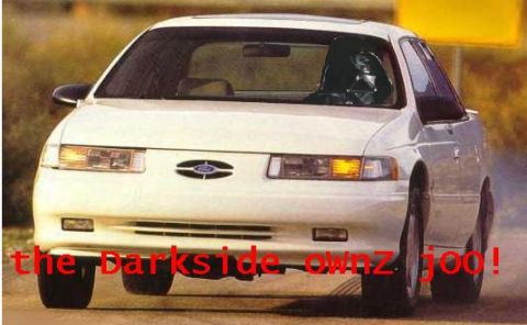 1993 Ford Taurus - A white 1992 Ford Taurus is shown from the front, with Darth Vader visible in the driver's seat and text overlay.