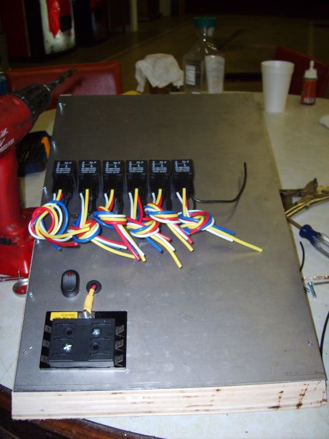 2004 Ford Crown Victoria - A custom wiring panel is shown with multiple relays and a fuse block, ready for installation.