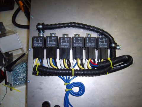 2004 Ford Crown Victoria - A close-up view of a custom automotive relay wiring harness, showing multiple relays and organized wiring.